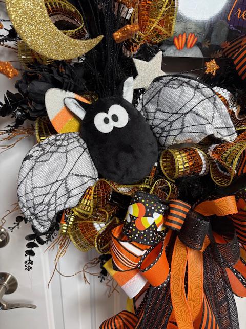 Oversized Halloween Wreath, Trick or Treat sign, Plush Bats, Candy Corn, Glitter Moon and an Oversized Bow