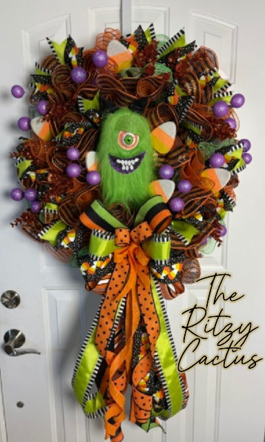 Green Furry One-Eyed Monster Halloween Wreath – Cute Spooky Door Décor with Candy Corn & Glitter Gumballs