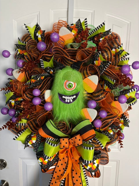 Green Furry One-Eyed Monster Halloween Wreath – Cute Spooky Door Décor with Candy Corn & Glitter Gumballs